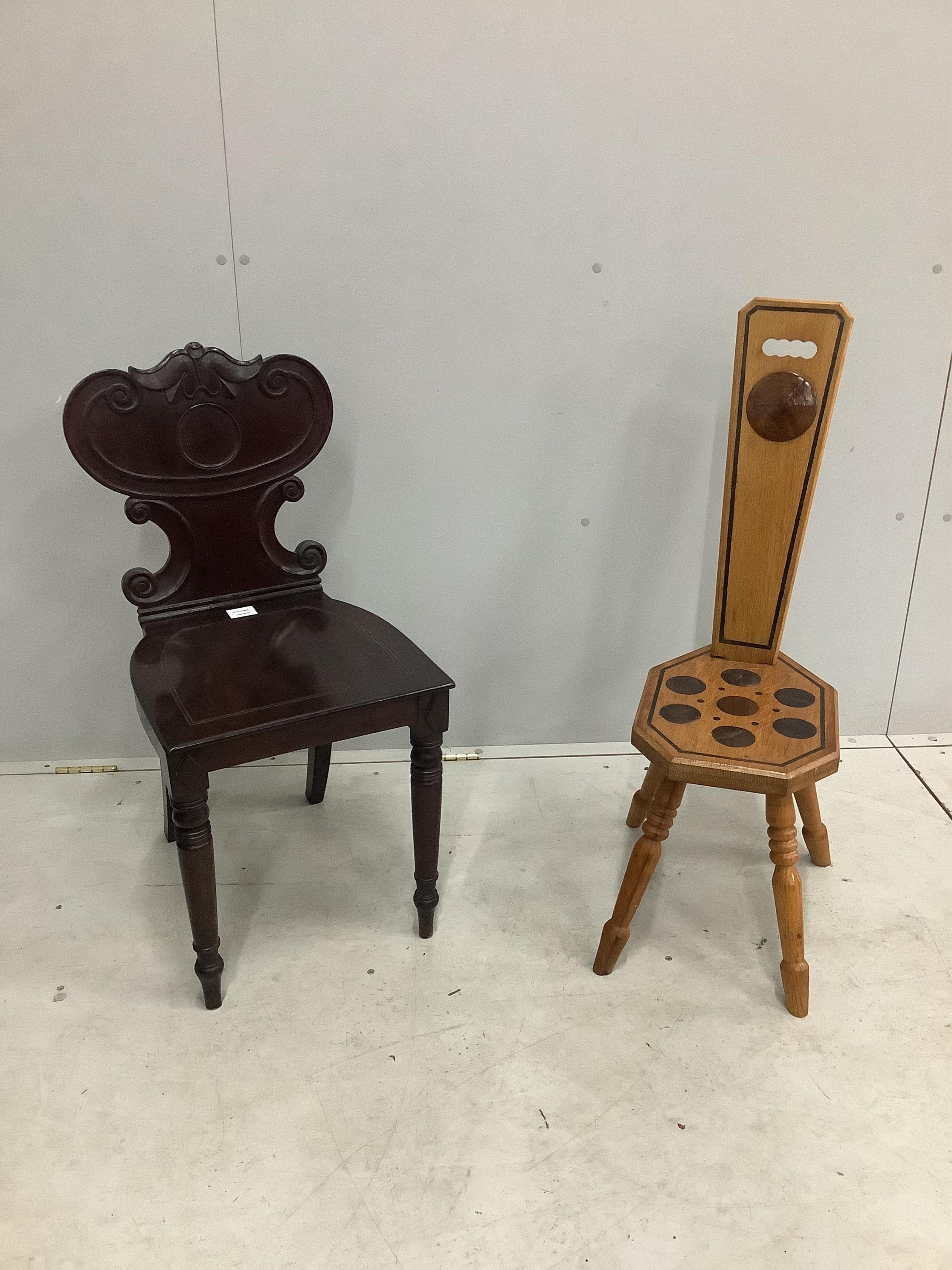 An early Victorian mahogany hall chair and a Continental inlaid oak spinning chair. Condition - both fair to good